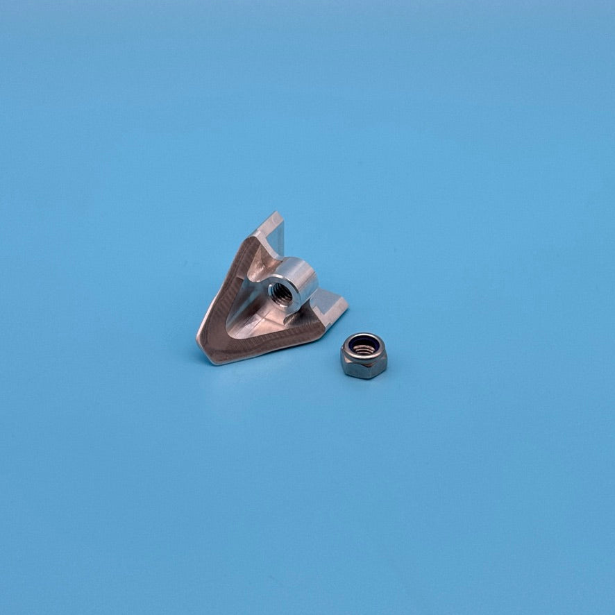 Rear angle of raw aluminum Thule Helium Platform XT locking wedge, showing threaded center hole and lock nut.