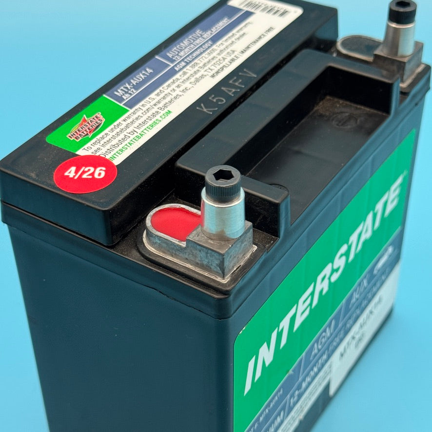 Top of MTX-AUX14 battery showing a bare aluminum CNC terminal adapter fitted over the post.