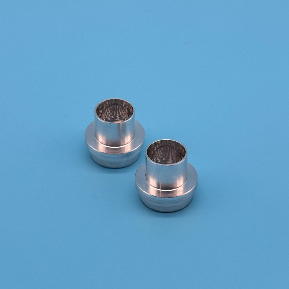 Bare aluminum CNC stepped barb hose fittings for Mercedes ML/GL expansion tank, side view showing flanged collar and bore.