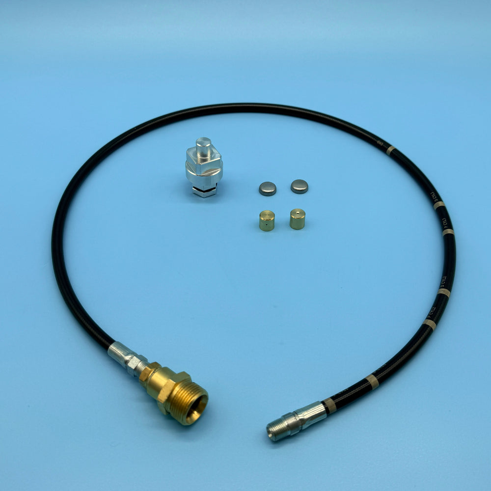 Audi V6 3.0/3.2 secondary air carbon cleaning kit: silver adapter, brass nozzle caps, and flexible delivery hose.