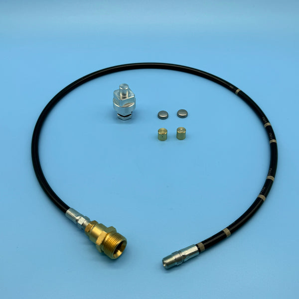 Audi V6 3.0/3.2 secondary air carbon cleaning kit: silver adapter, brass nozzle caps, and flexible delivery hose.