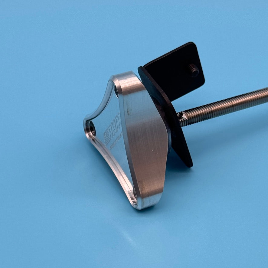 AHM-engraved aluminum wedge handle close-up for Thule T2 bike rack, with black bracket and rod.