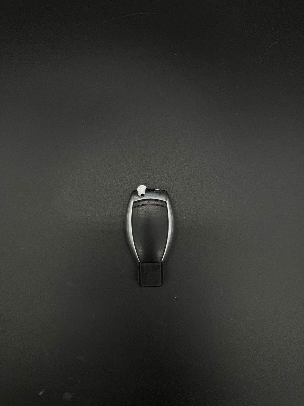 Mercedes-Benz smart keyfob back showing the white GEN-2 emergency blade blank tab in place.