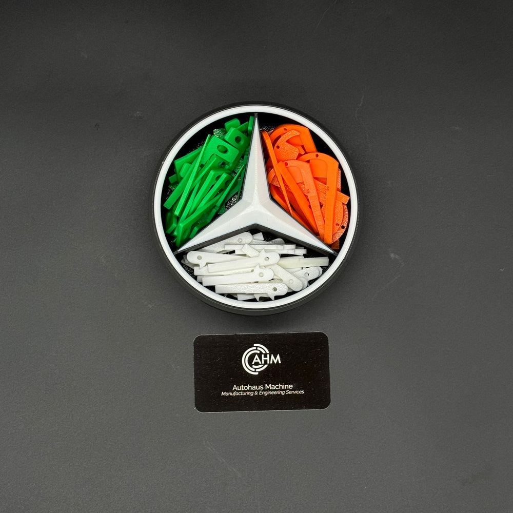 Mercedes-star key blank organizer holding green, orange and white GEN key blanks in three bays.
