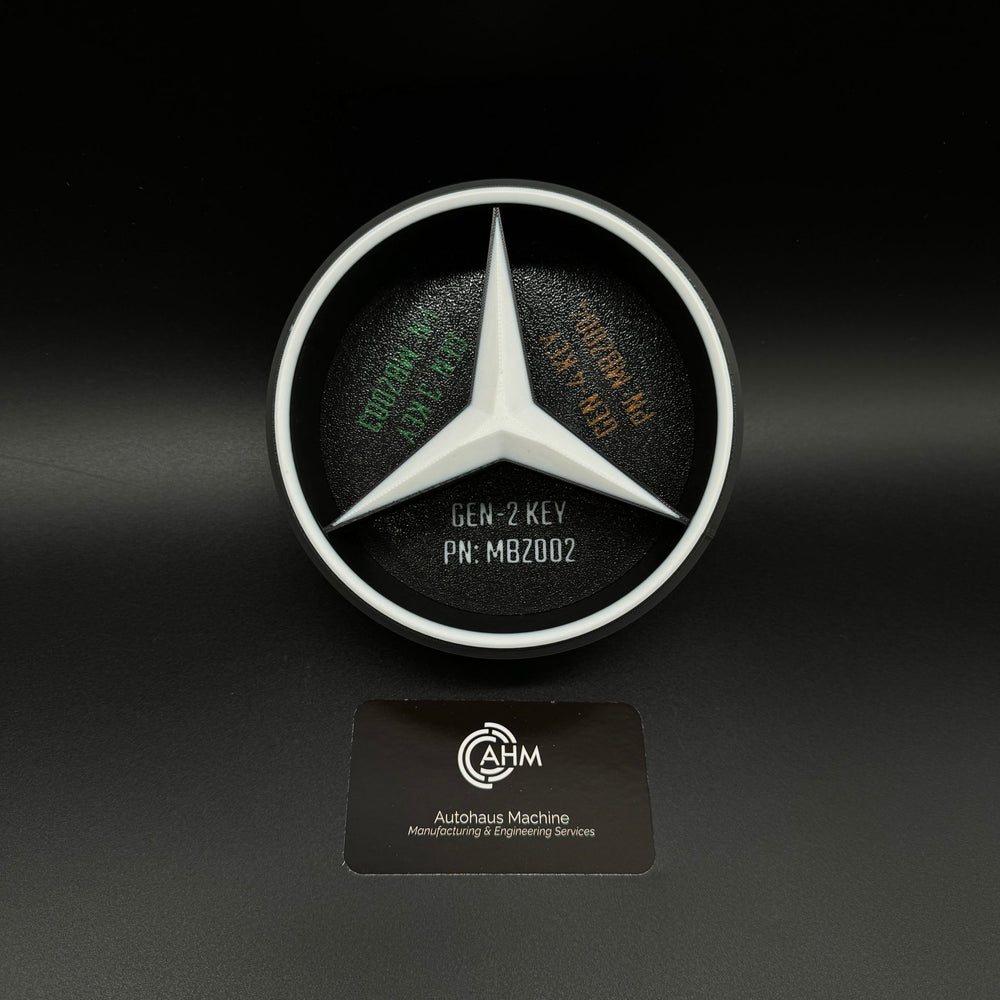 Key blank organizer interior with Mercedes star divider, labeled GEN-2 KEY PN: MBZ002 and fitment text.
