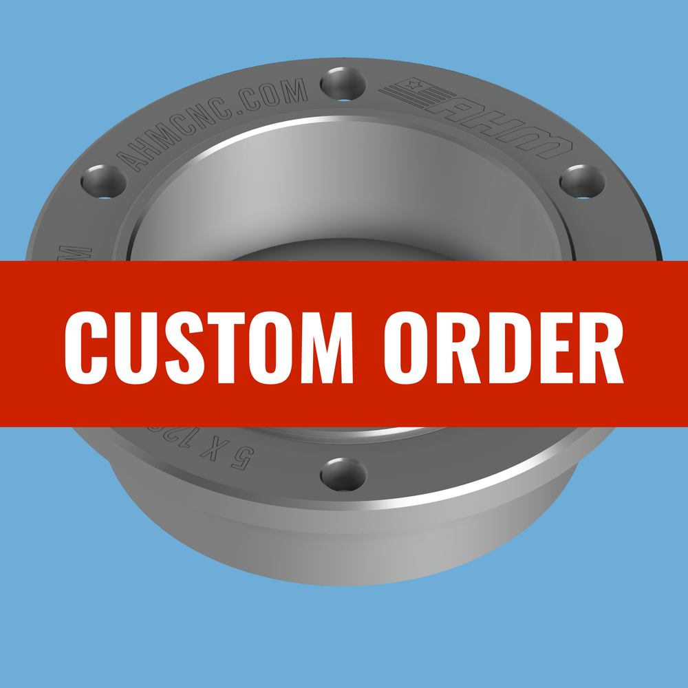 Top view of CNC custom ProHub dyno adapter engraved AHMCNC.COM, red CUSTOM ORDER banner across it.