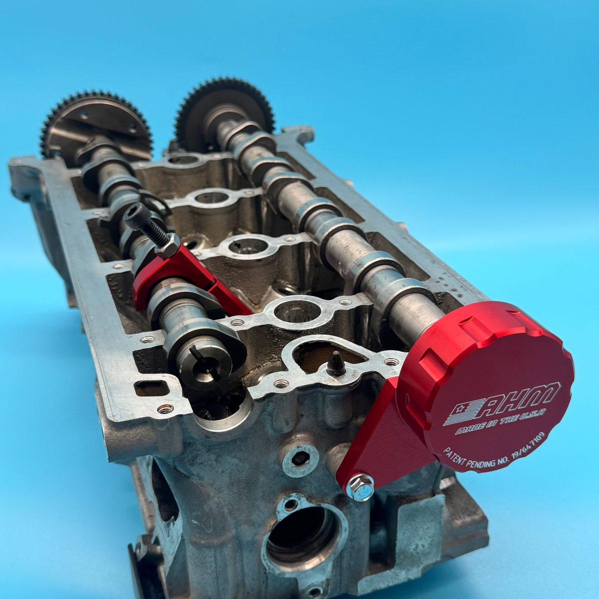 Camshafts retained by the AHMCNC tools with the cylinder head cover removed