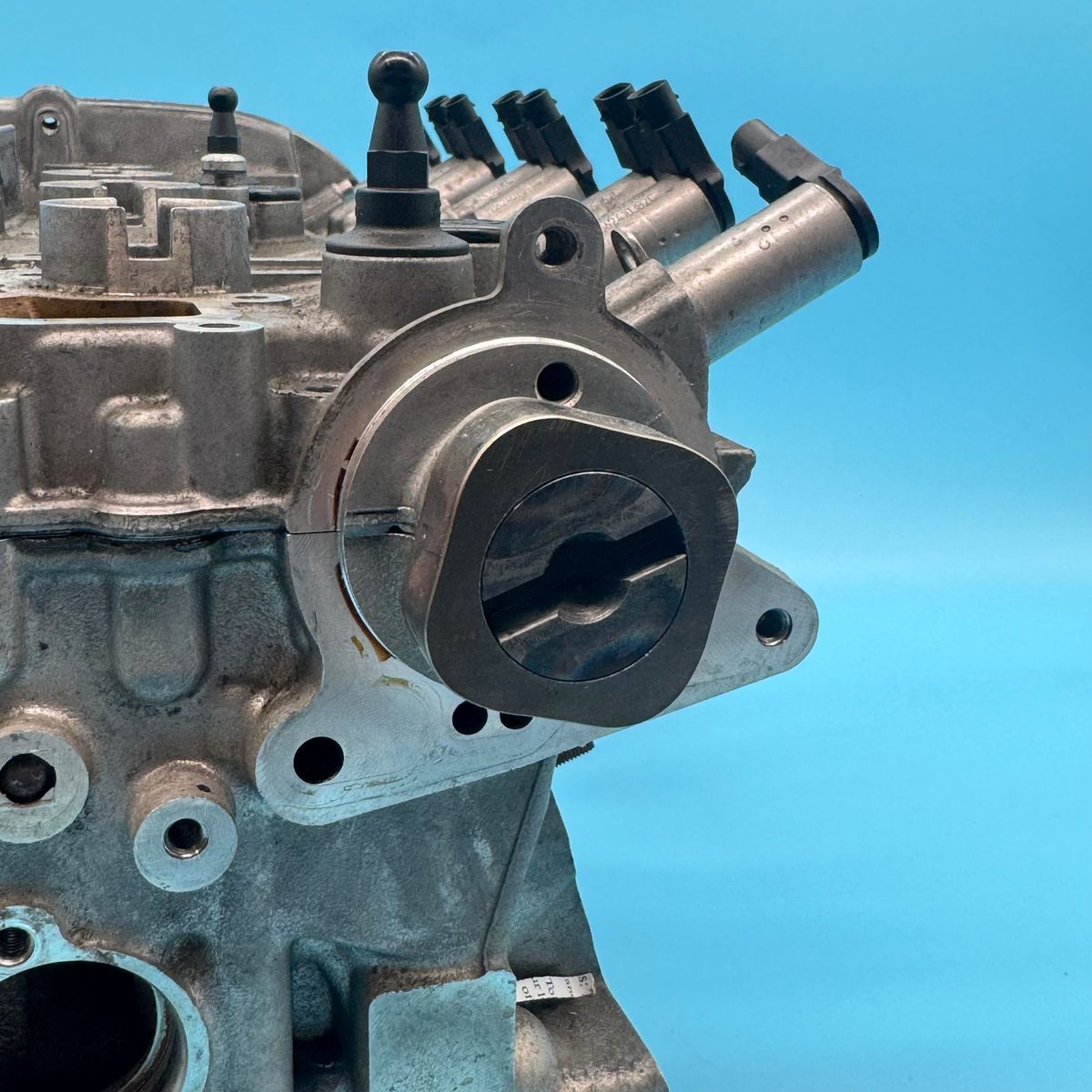Locating the boss on the exhaust camshaft that drives the vacuum pump