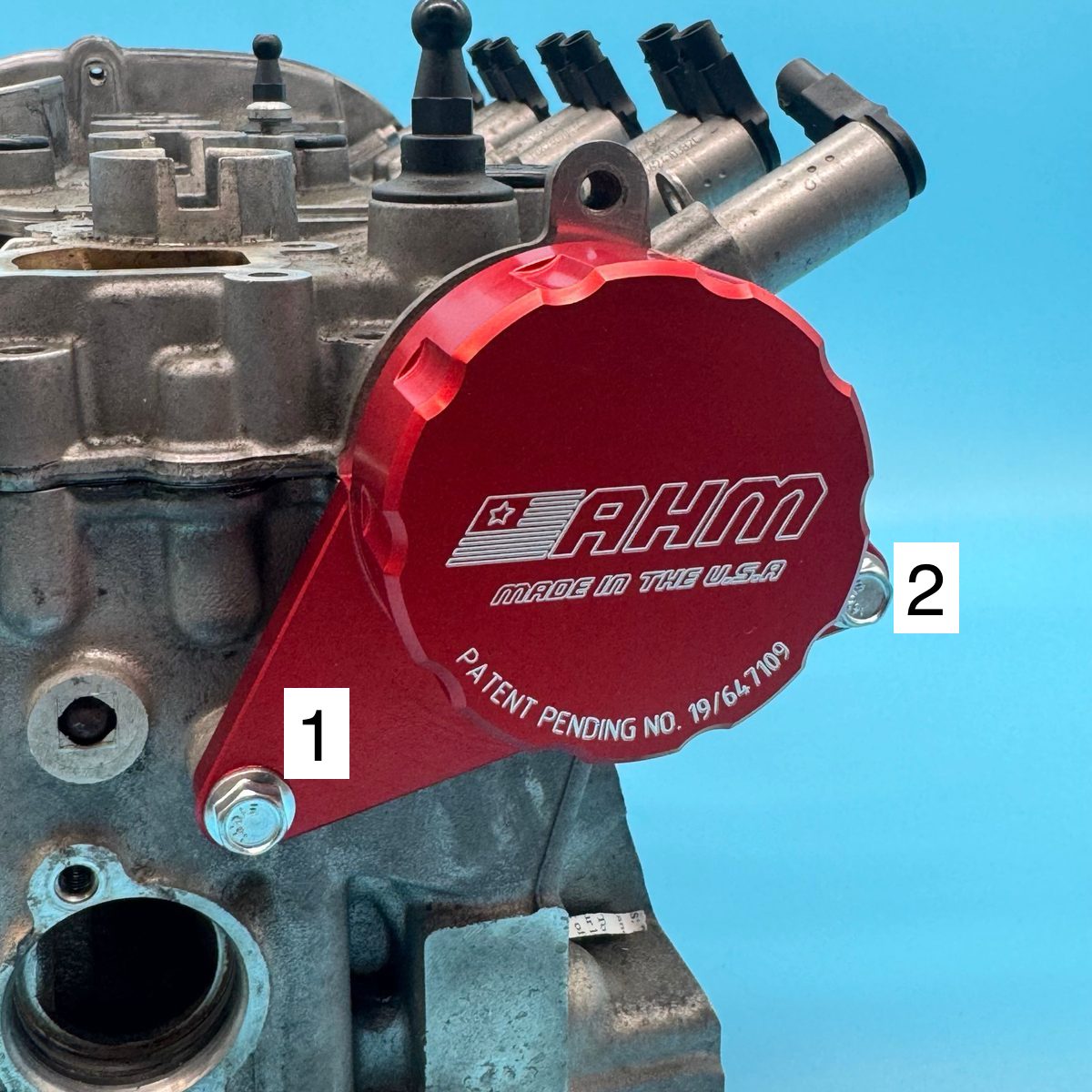 Exhaust camshaft retaining tool fastened to the cylinder head with two bolts