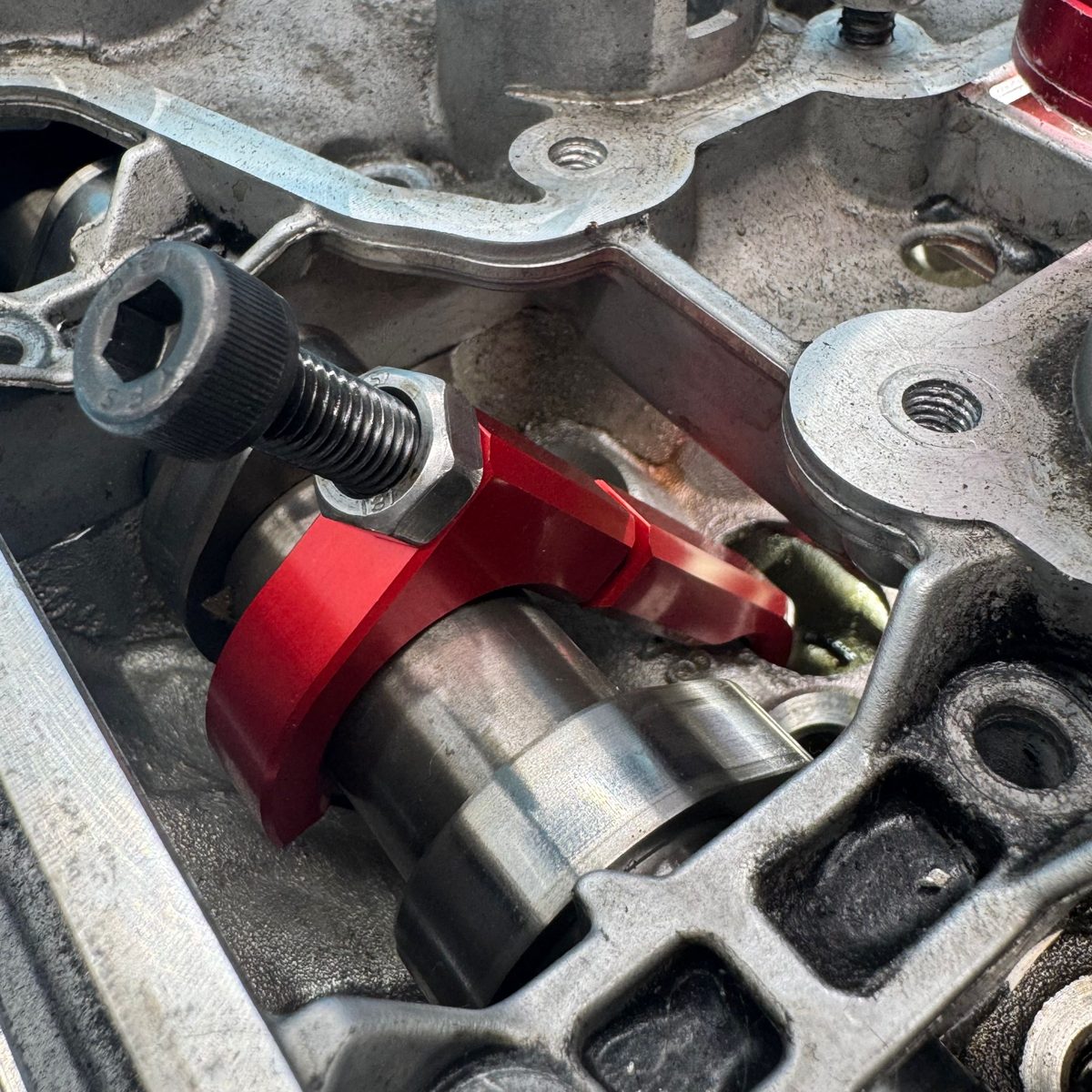Tightening the locknut to secure the intake camshaft retaining tool